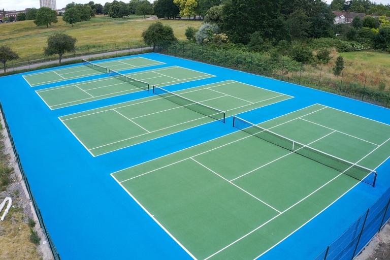 Aerial photo of three tennis courts