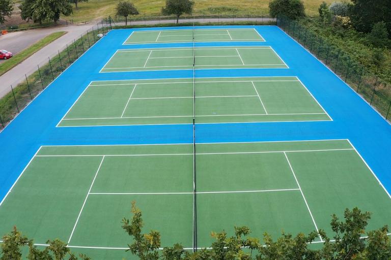 Aerial photo of three tennis courts