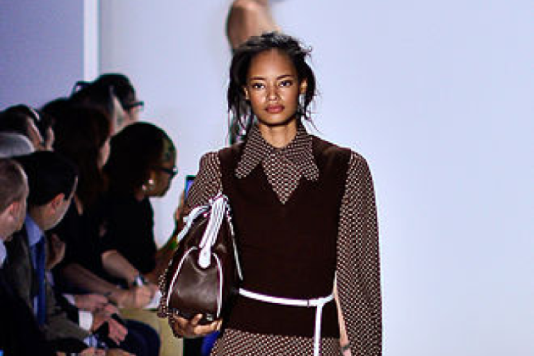 Photograph of a female, black model on the runway