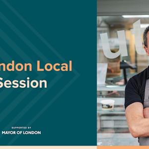 Photo of a man in an apron in a kitchen standing alongside a poster of the event